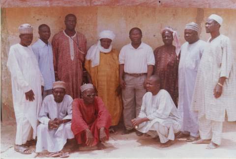 Pictures one and two. In picture one is the researcher, F.A Olasupo, standing by the left of the female king, Hajia Hadisa Muhammed. To the right is the research assistant.