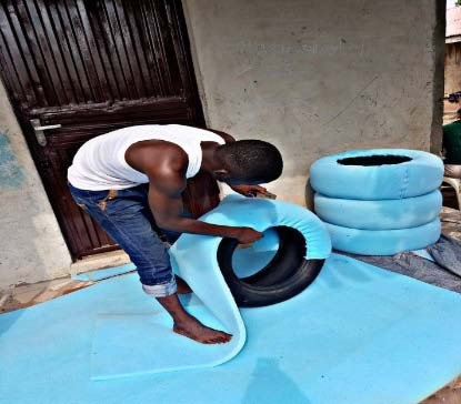 Fieldwork (2019) Plate 8: Cutting of tires into two to create a back rest Researchers Fieldwork (2019) Plate 9: Insertion of plywood pieces into Researchers Fieldwork (2019) Plate 9: Fixing of metal stands to the furniture base Researchers Fieldwork (2019) Plate 10: Seat wrapped with foam Capacity-Building in Waste Wealth: Reusing of Discardedtires for Making Home use Furniture Researchers Fieldwork (2019) Seat wrapped with foam and fabric Researchers Fieldwork (2019) Plate 12: Complete Set of tyre made furniture