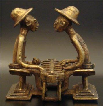 Figure 6: Akan gold-weight, Two people playing "oware"