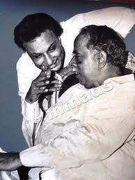 Sathyaraja Pictures Release date 19 May 1967 Positve Outcome of the Movie: The hero tries to establish equity and social justice in the Kumari country and at the same time finds ways and means to get Asokan and the king's daughter get married. Finally he fulfills his task of handing over the Kumari Country and Manimangalam to Asokan and leaves the place to lead the life of an ordinary citizen along with his wife Jayalalitha the heroine of the movie. *https://en.wikipedia.org/wiki/Arasa_Kattalai Consider the following song from the movie Arasa Kattalai; song written by Kavingar Vali and sung by T.M.Soundararajan, film directed by M. A. Thirumurugam (1966). Original Song written in Tamil Translation of the song in English Someone made me to sing He is the leader of my song Flawless person who is the God without a temple He will laugh just as flowers in the garden Will exist like a moon in the dusk Will exist as the wave in the cool river Will expand like an umbrella in the hot summer How many dances would take place in his darbar Birds will reside in his garden He is the king of all the arts He is the bounty to all the artist There is no doors in his house There is no guards in the doorway How many billions he had given His blessed face should live for ever He made me to sing He is the basis of my song Flawless person who is the God without a temple